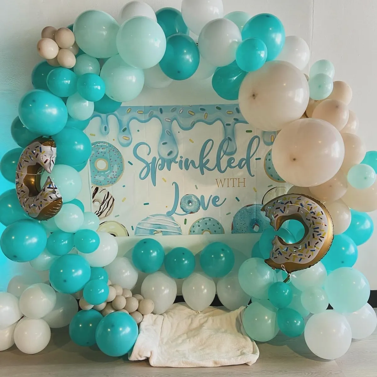 Teal and white balloon garland baby shower backdrop at Event Center Miami