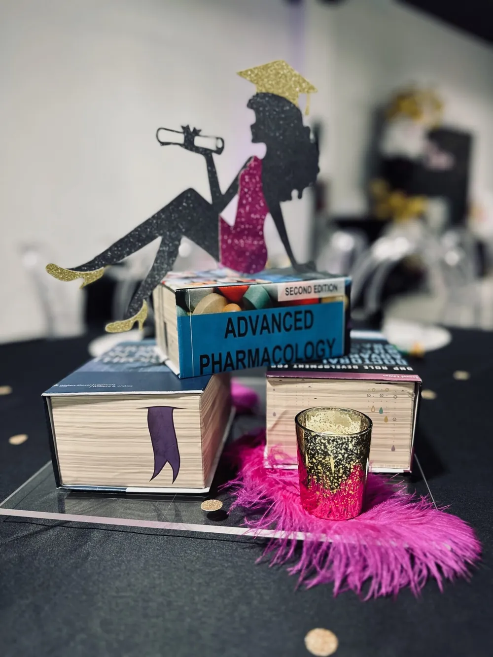 Graduation party table décor with a cap silhouette centerpiece at Event Center Miami