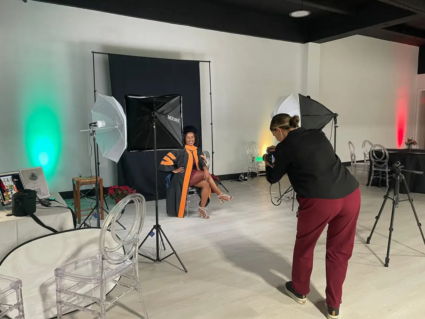 Photographer working with lighting equipment during a photo shoot at Event Center Miami