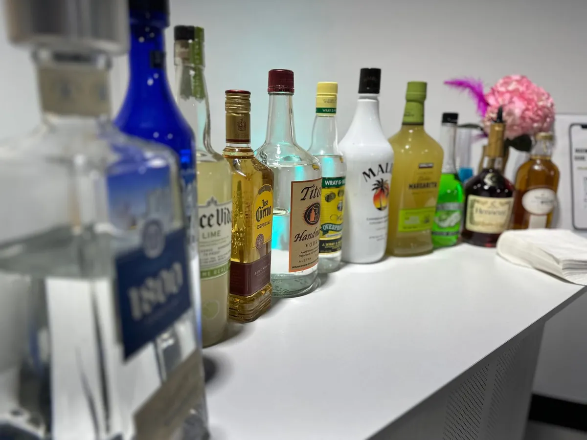 Bottles arranged on the portable bar station at Event Center Miami